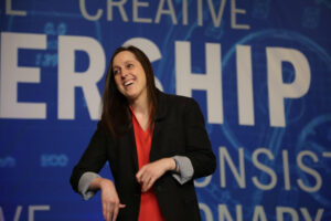 Why did a client ask me to carry my backpack on stage?