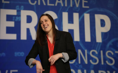 Why did a client ask me to carry my backpack on stage?